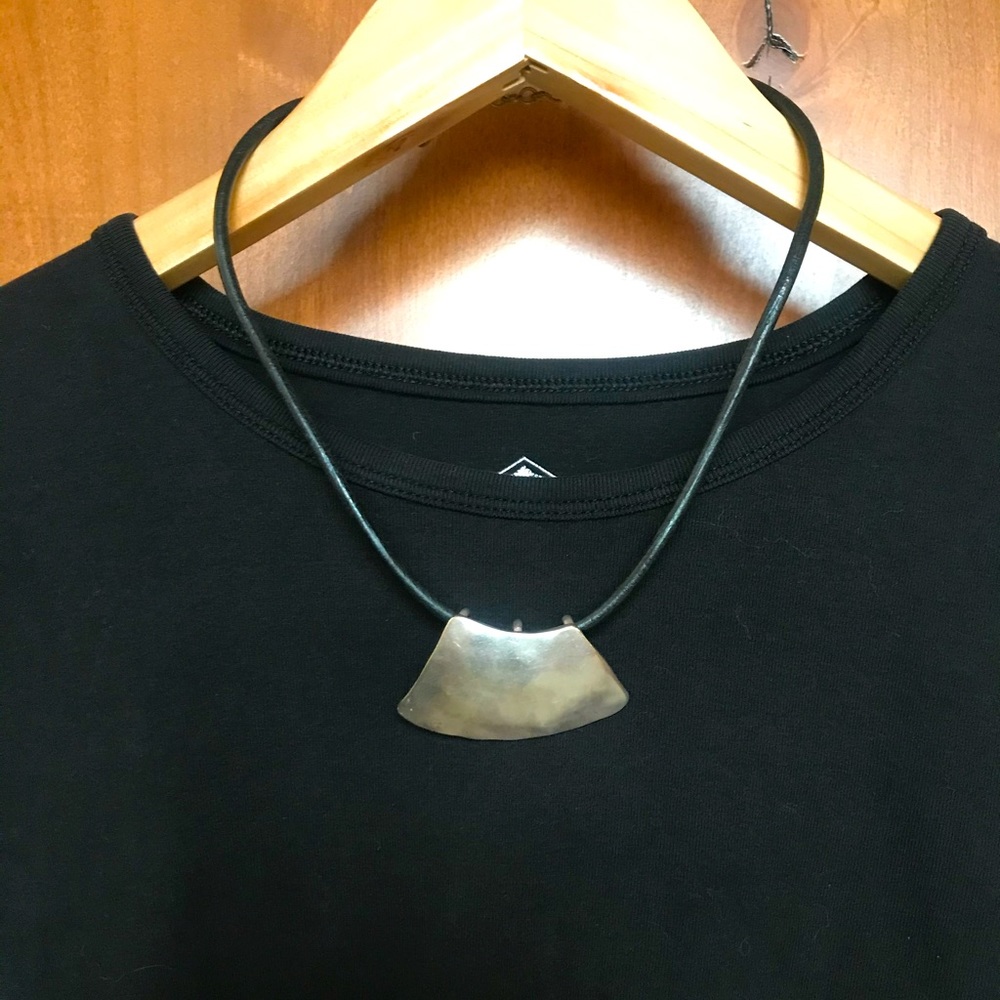 Silver and black cord necklace.